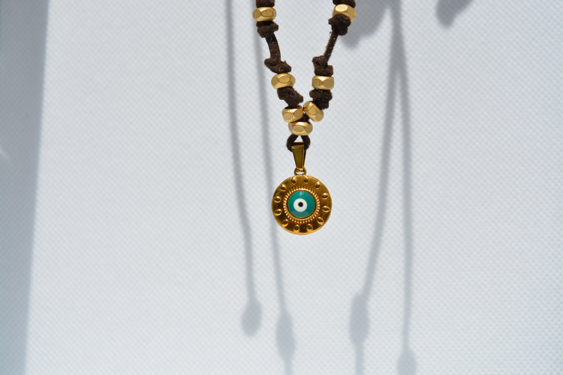 Collana con ciondolo occhio turchese dorato
